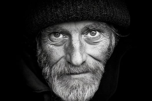 A black and white photo of an old man