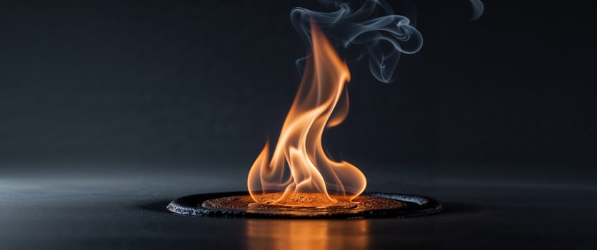 A somber reflective flame burning with a subtle glow that mourns photo