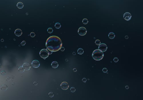 Numerous translucent bubbles float in the air with reflections of light and color. photo