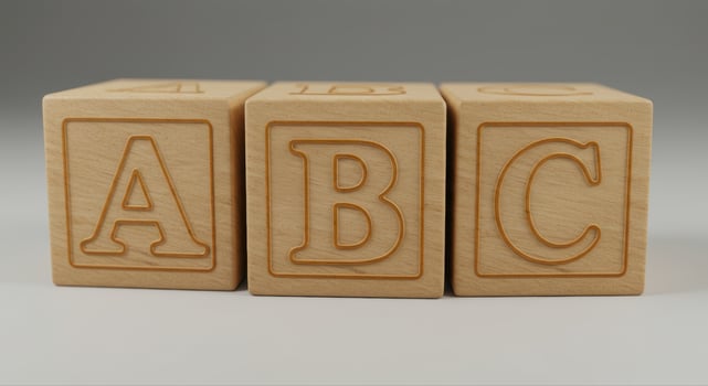 Three wooden blocks with the letters a, b, and c side by side, perfect for learning. photo