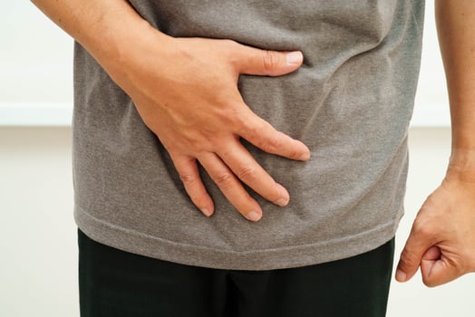 Hernia, Asian man stomach ache, abdominal pain and urology problem photo