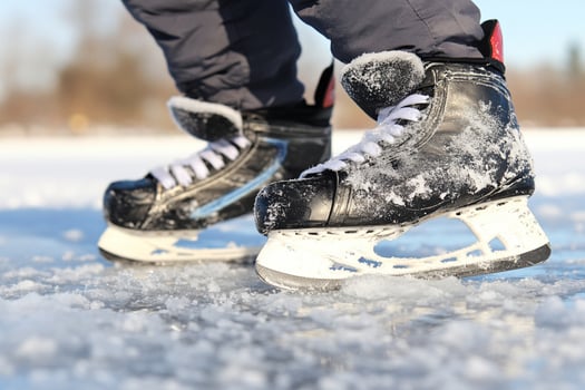 A person wearing ice skates on a frozen lake photo