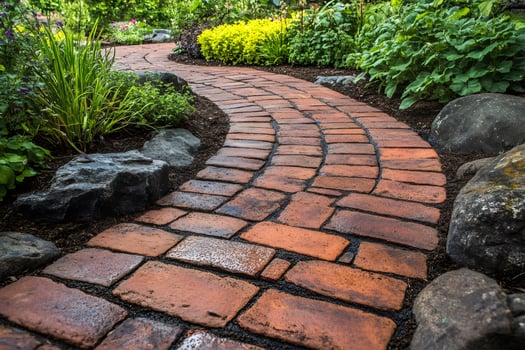Winding brick path enhancing lush garden landscape photo
