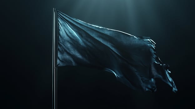 Black flag waving in the wind on a dark background photo