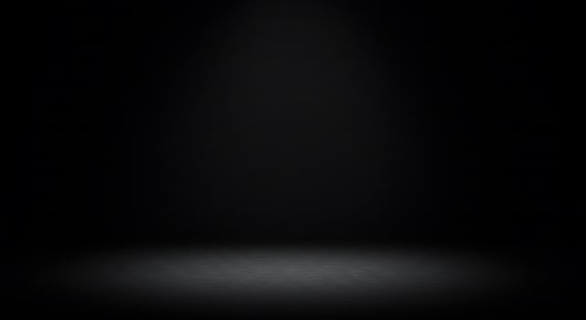 Black background with light spot on the floor photo