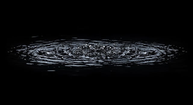 A black background with water ripples photo