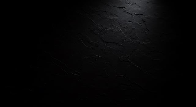 Black wall with light shining through it photo