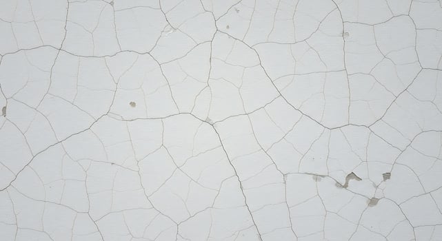 Cracked white wall with cracks and cracks photo