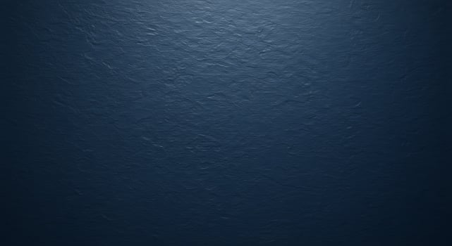 A dark blue wall with a white background photo