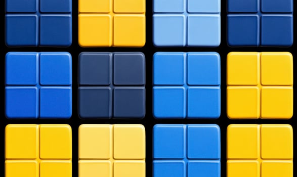 Colorful geometric arrangement of square tiles, showcasing blue and yellow shades with dark elements that create a visually appealing design pattern. photo