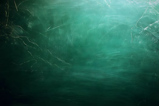 Green chalkboard with textured surface showing subtle scratches and marks reflecting years of classroom use, education background photo