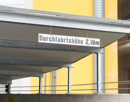 German clearance height sign in urban setting with modern architecture photo