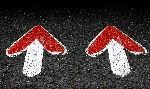 Dual Directional Arrows on Asphalt Surface Indicating Right and Left Turn for Effective Road Traffic Guidance During Daytime with Clear Visibility photo
