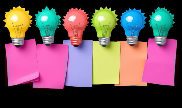 Colorful Light Bulbs with Sticky Notes on Black Background for Creative Ideas and Brainstorming Concepts in Office or Home Environment photo
