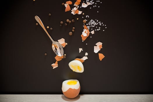 Boiled egg. Creative concept of breakfast with egg and salt photo
