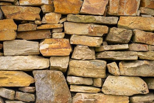 View of the brickwork. View of a brick fence made from many different stones photo