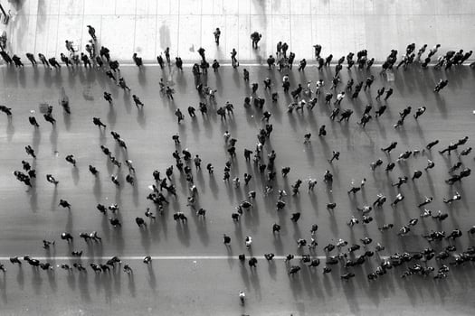 A crowd of people walking on a street photo