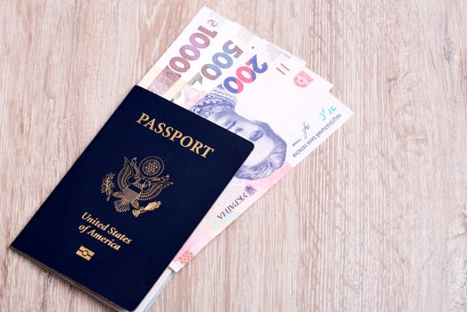 American passport with Ukrainian money photo