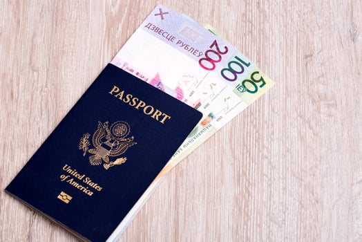 American passport with Belarusan money photo