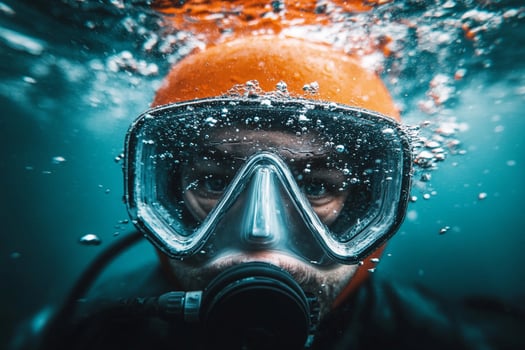 A man wearing a scuba mask and diving helmet photo