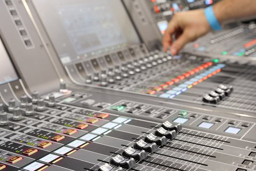 Sound engineer hands adjusting control sound mixer in recording photo