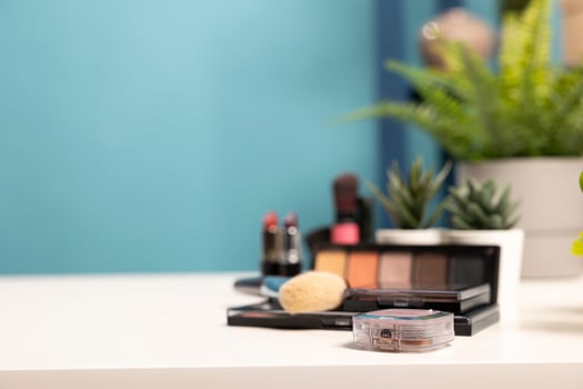 A minimalist beauty workspace with carefully placed skincare and makeup essentials, complemented by small plants. Ideal for digital marketing, online stores, and social media branding. photo