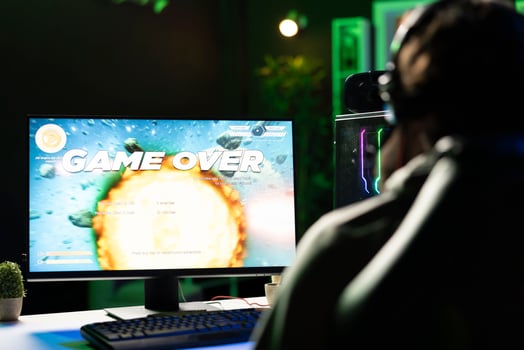 Gamer receiving game over screen, getting his spaceship destroyed in huge explosion while flying in galaxy, killed by enemies. Man losing science fiction spacecraft videogame level photo