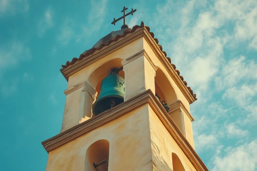 Church bell tower reaching for the heavens on a sunny day photo