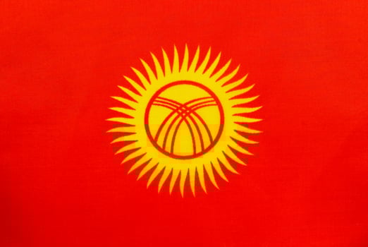 National flag of Kyrgyzstan displayed with bright colors photo