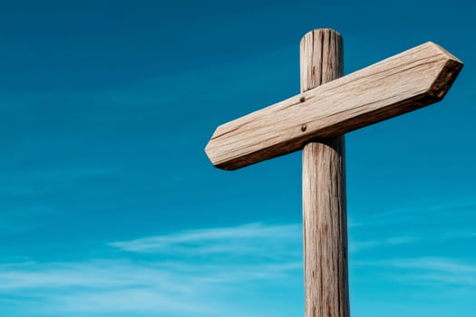 Empty wooden sign pointing the way on a clear sunny day photo