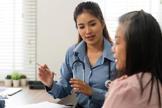 Consultation and Patient Interaction. The doctor explains treatment options to an elderly patient. photo