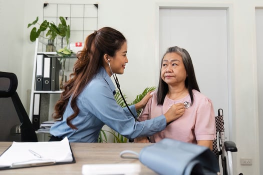 Healthcare and Elderly Care. Compassionate medical professional conducting a routine checkup for an elderly patient. photo
