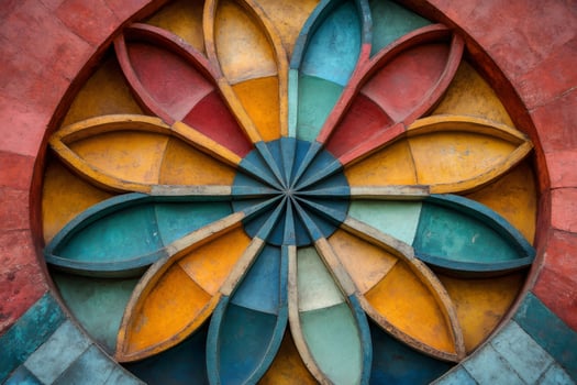 Colorful circular design forming a flower on building exterior photo