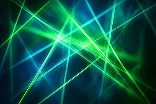Green and blue laser beams creating a dynamic abstract light pattern photo
