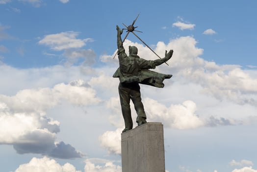 Statue of man which holds a star. Dnipro metro station in Kyiv, Ukraine photo
