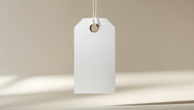 Blank white price tag hanging on a string photo