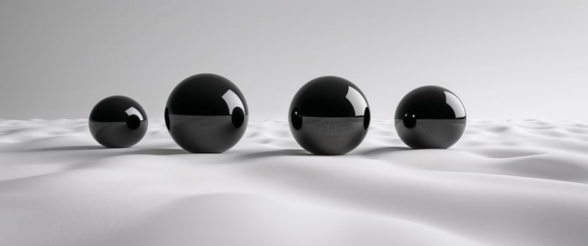 A group of black spheres in a field photo