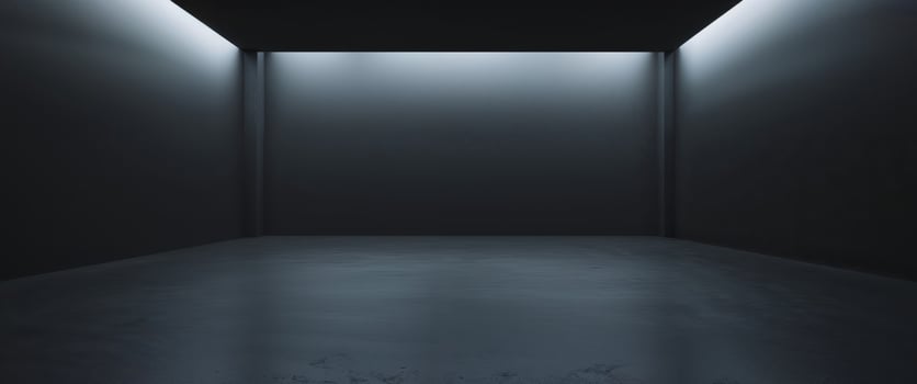 An empty room with a light coming from the ceiling photo