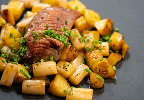 grilled duck breast with asparagus and potatos photo