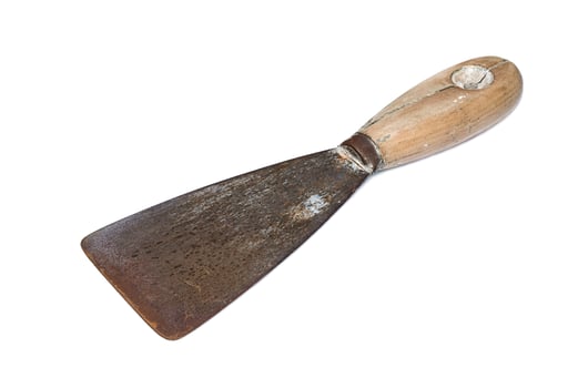 Old rusty spatula on a white background photo