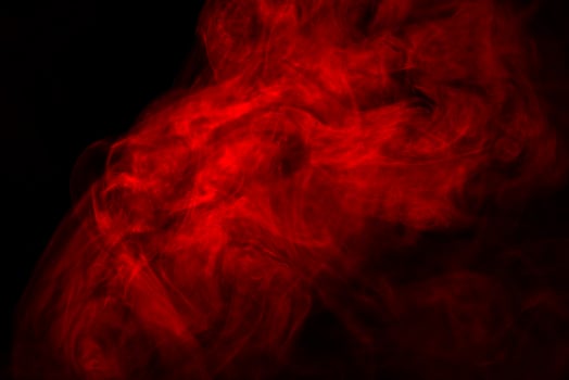 Red and black background with smoke photo