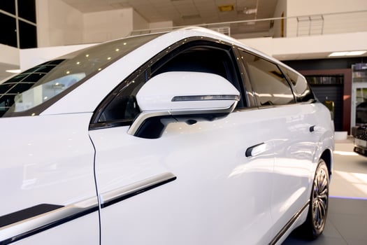 Close up view of the side of a new modern white car photo