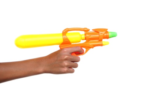 Hand hold plastic toy gun, squirt gun to shoot on white background Concept, children play. Kid water pistol toy. Favorite equipment for Songkran Festival in Thailand. photo
