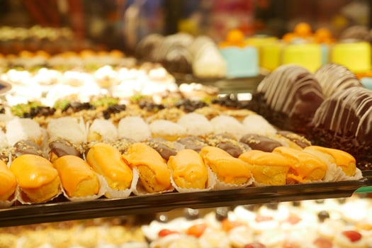 Colorful selection of pastries displayed in a dessert shop photo