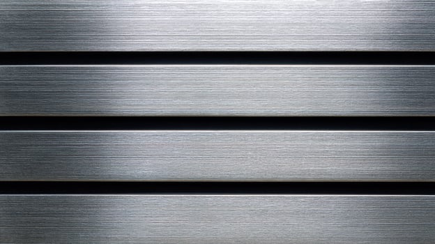Brushed metal texture with horizontal lines featuring a smooth silver finish and subtle grooves for industrial or design use. photo