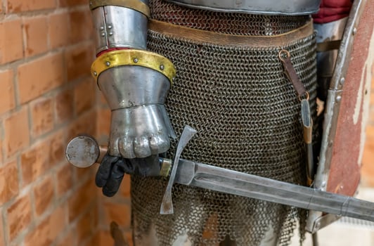 A medieval knight holding a sword and shield photo