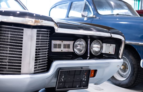 A close up of the front grille of an old car photo