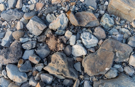 Rocks and gravel on the beach photo