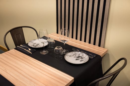 Elegant table setting with black and white plates in modern restaurant photo