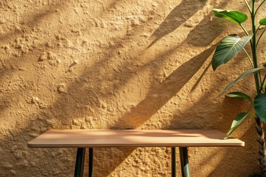 A simple wooden bench against a textured ochre wall. photo